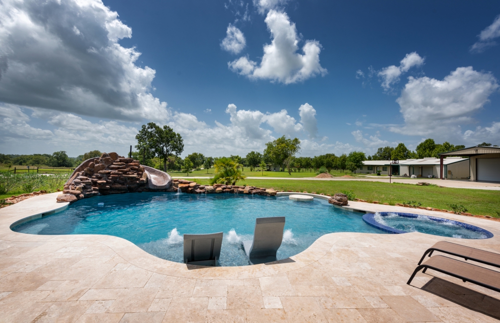 A renovated pool feature grotto for a backyard swimming pool - Miller Pools