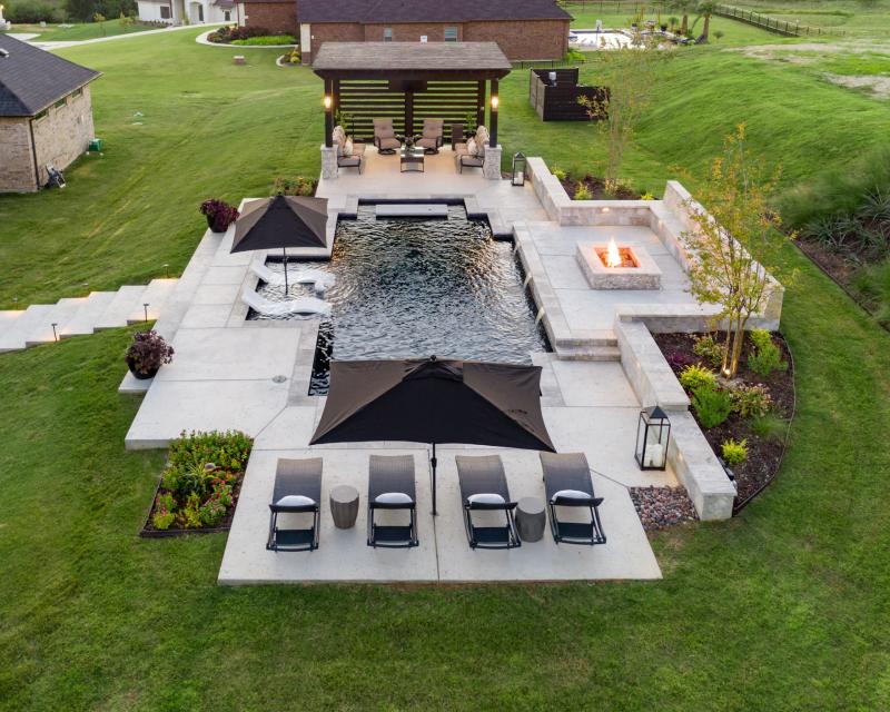 Residential outdoor swimming pool with fire pit - Miller Pools